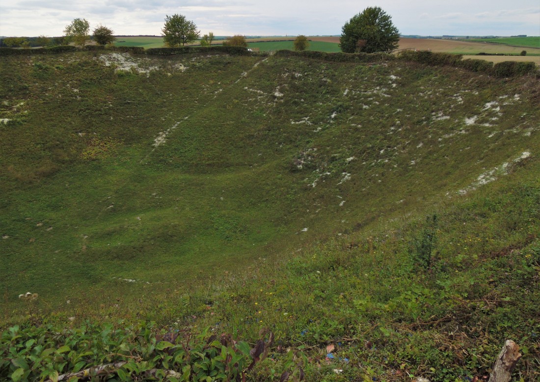 Lochnagar Crater. A dimple on the horizon behind the gate on the far side of the crater is the Golden Virgin atop Albert's basilica. [Copyright 2018: A. Matthews]