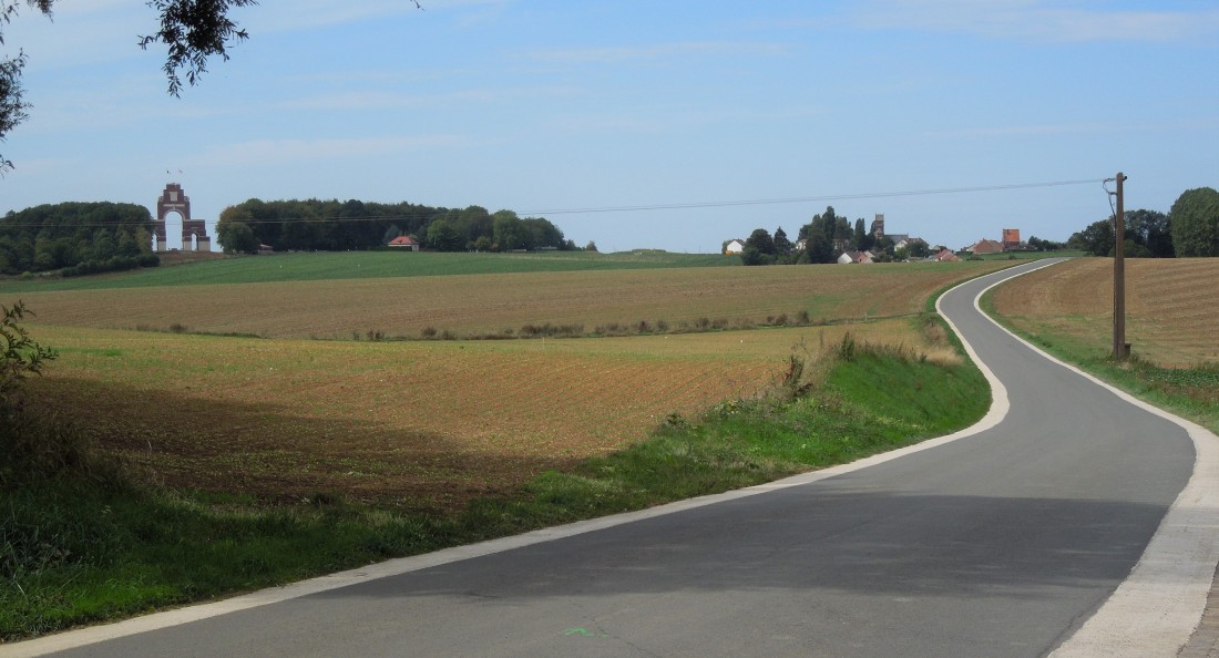 The road to Thiepval Ridge with the Memorial and village visible from Mouquet Farm (Mucky Farm or Moor Cow Farm as soldiers knew it). The British direction of attack was towards the camera but they had to fight up the hill on the other side of the ridge first. [Copyright 2018: A. Matthews]